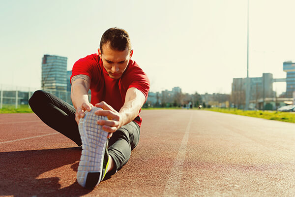 man stretching before step ups