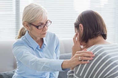 behavioral therapist comforting her client
