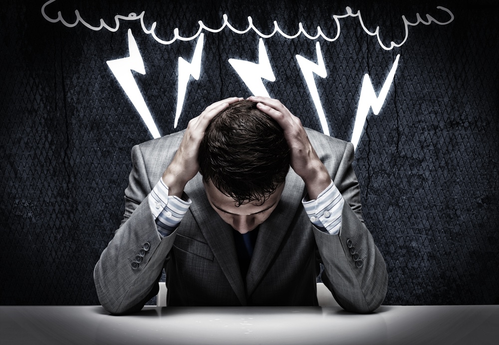 Man puts his hands on the back of his head in desolation, with illustration of clouds and lightning as his background