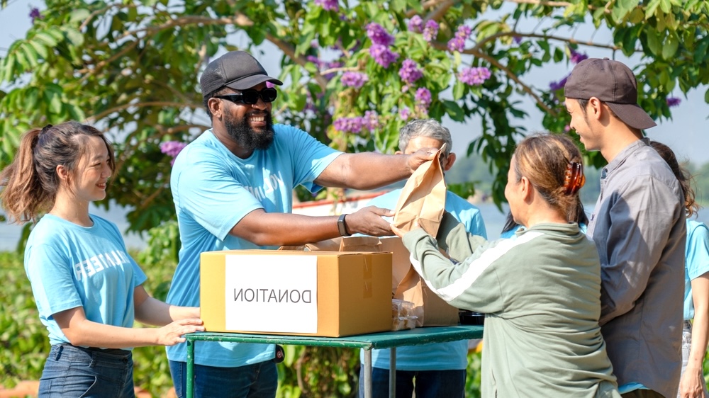 People who are engaging in a donation program in a community.